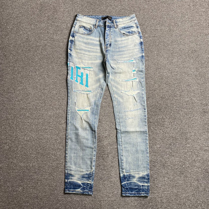 AMIRI VARSITY LOGO JEANS