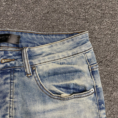 AMIRI VARSITY LOGO JEANS