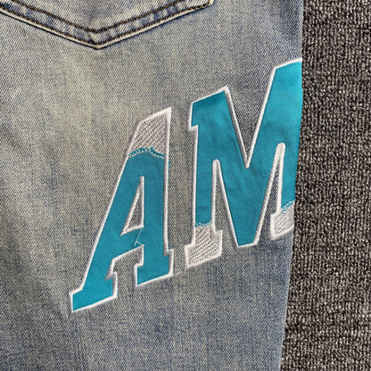 AMIRI VARSITY LOGO JEANS