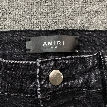 AMIRI VARSITY LOGO REPAIR JEANS