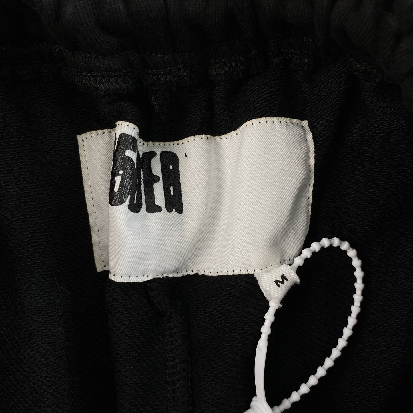 SP5DER SEX AOP SWEATPANTS BLACK