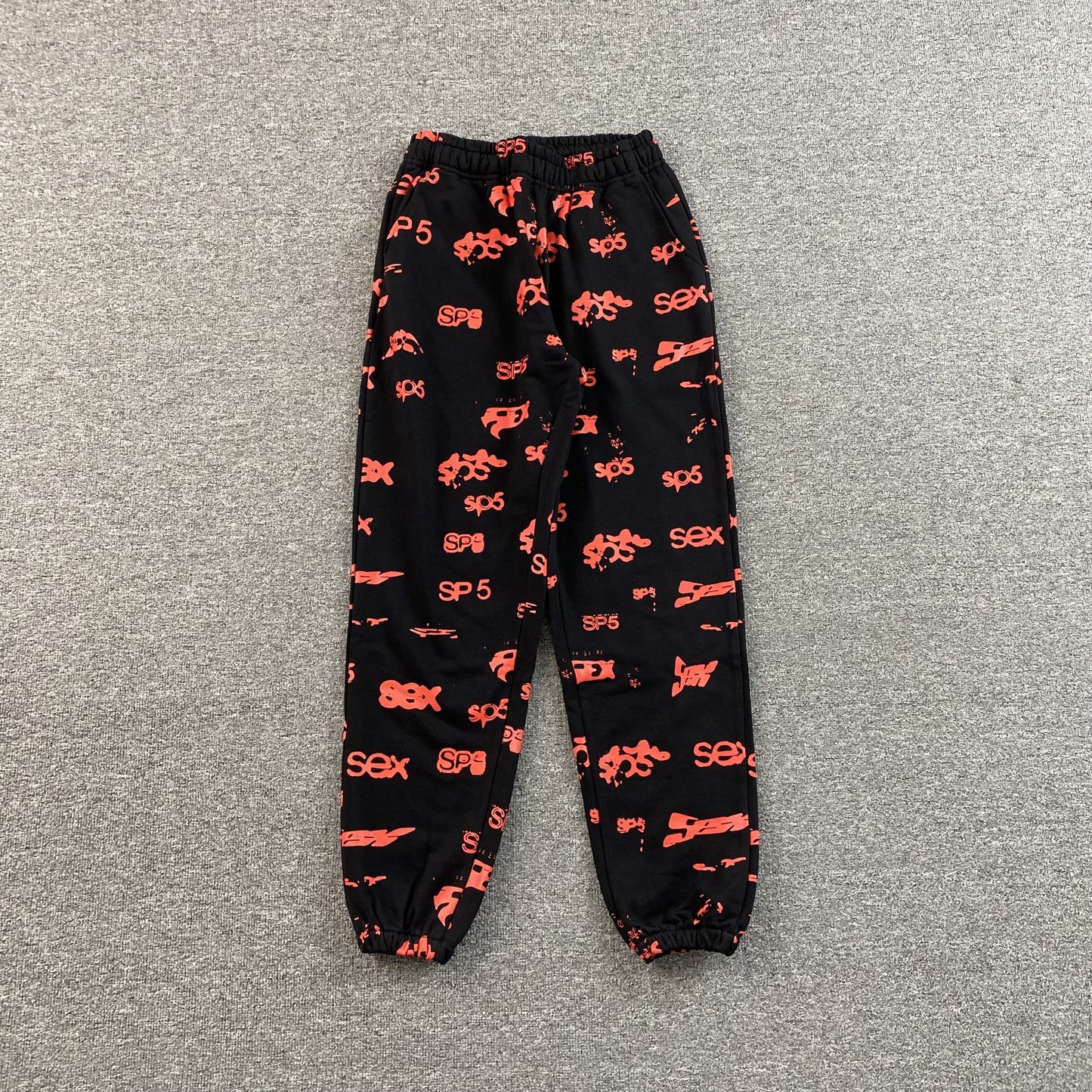 SP5DER SEX AOP SWEATPANTS BLACK