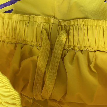 SP5DER DOUBLE LAYER SHORTS YELLOW